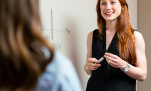 Female leader talking to a colleague