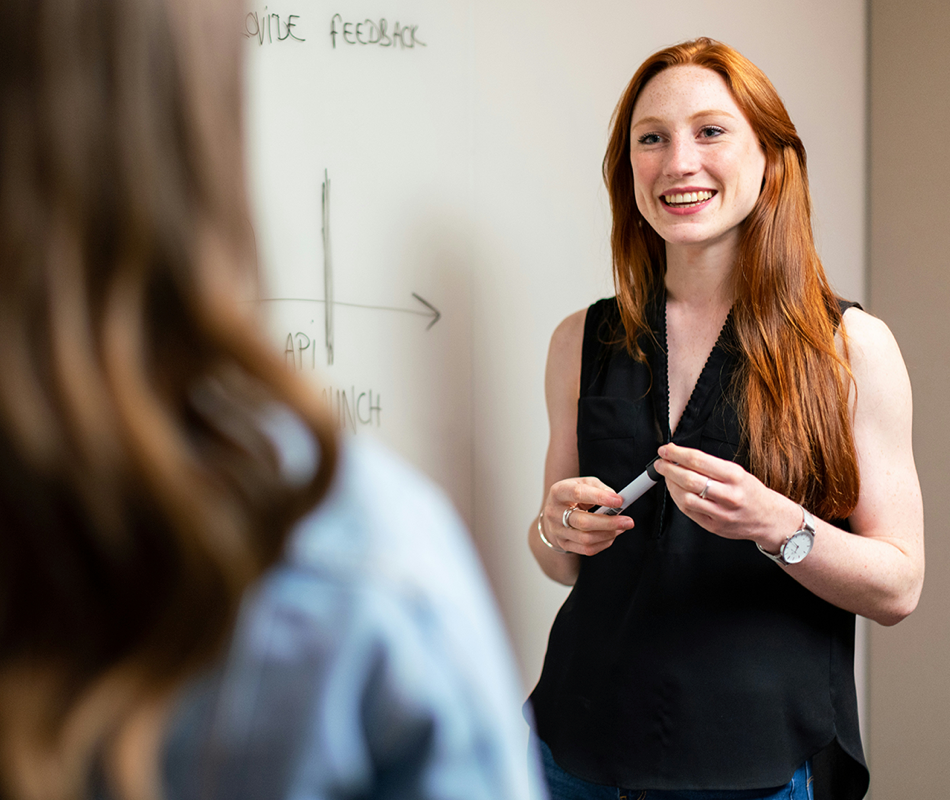 Female leader talking to a colleague