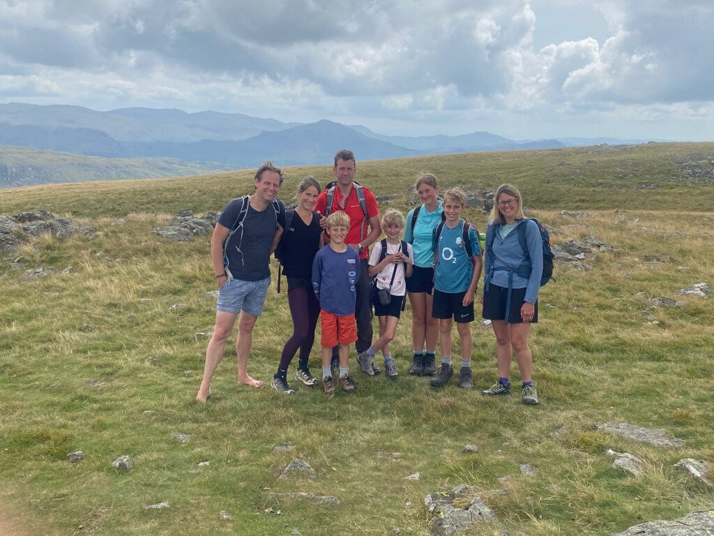 The Atherton and Dawson families on a hillside in the Lake District